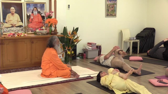 Practising asanas with Vishwaguruji